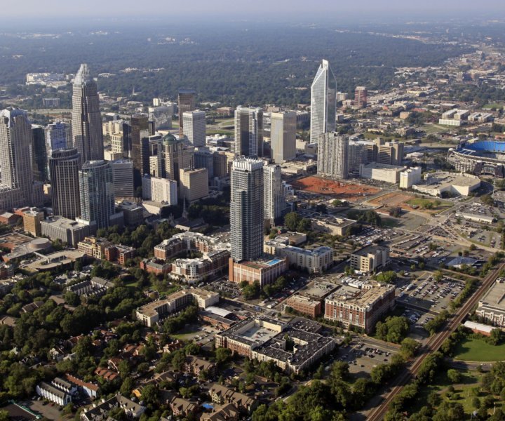 
				FILE - The skyline of downtown Charlotte, N.C., is shown in this Aug. 16, 2012 file photo. The U.S. Census Bureau announced on Thursday, March 27, 2014 that North Carolina's population is approaching 9.9 million people and that the state has five of the nation's 100 fastest-growing counties.  (AP Photo/Chuck Burton, file)		