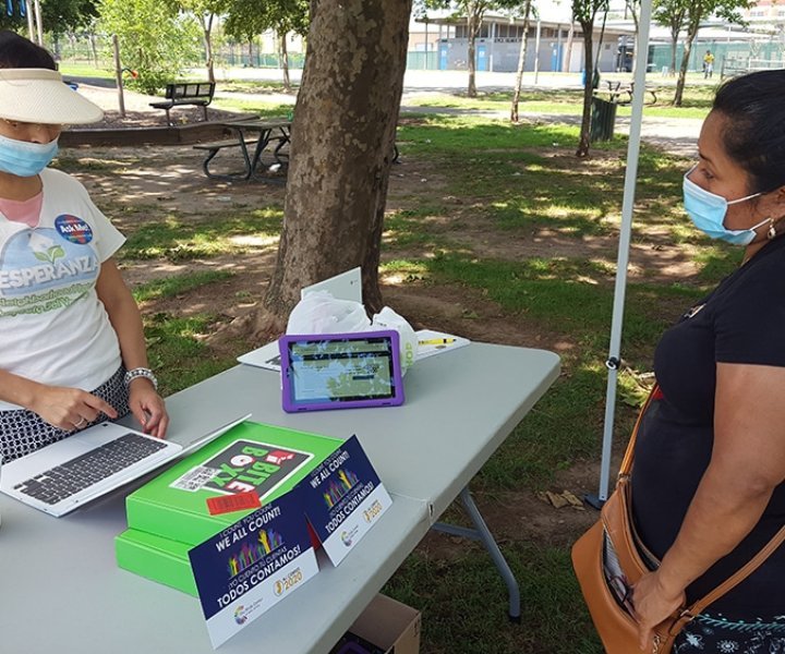 Margarita García filled out the census questionnaire with the help of the Esperanza Project volunteers at the Census kiosk in Joyce Kilmer Park, New Brunswick. García registered in the questionnaire her two children, her husband and her brother-in-law.