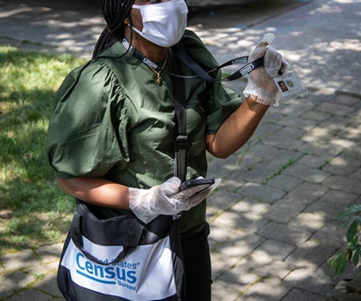 Census takers wear a mask while conducting their work. They follow CDC and local public health guidelines when they visit. Photo credit: U.S. Census Bureau.