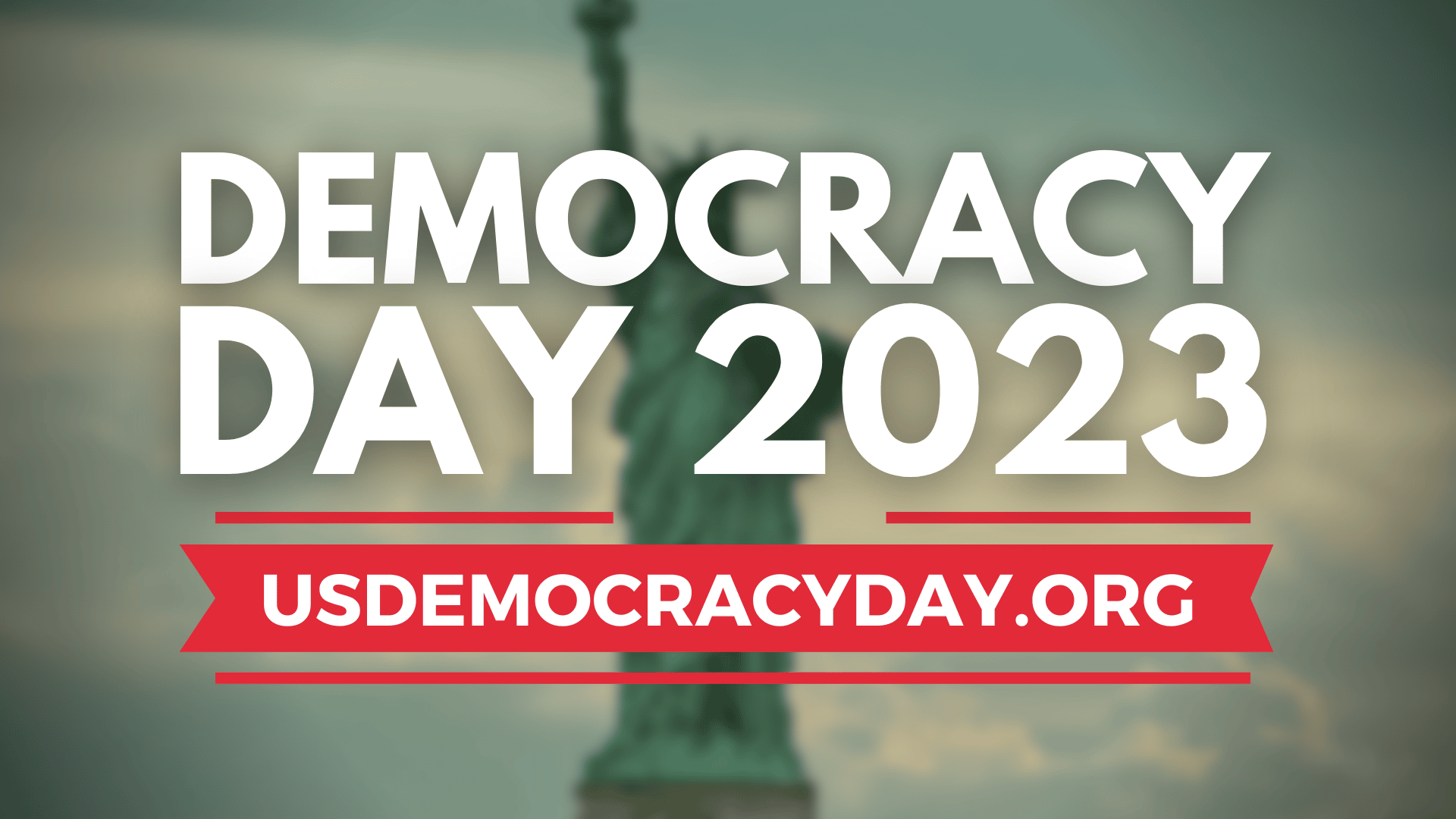 DECORATION ONLY: White text against a blurred background image of the Statue of Liberty. The text reads, "DEMOCRACY DAY 2023: Sept. 15, 2023 | usdemocracyday.org"