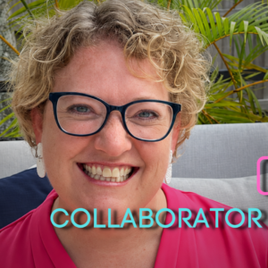 Joy Mayer smiling with short curly blond hair and dark-framed glasses sits on a light gray outdoor sofa, wearing a bright pink blouse and white earrings, with green palm fronds and a wooden fence behind her.